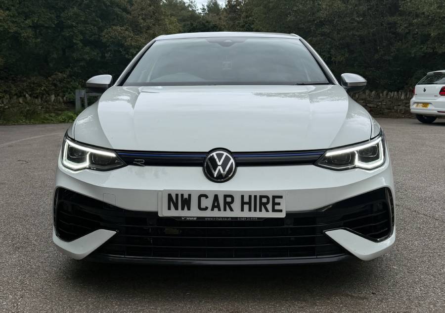 Modern white Volkswagen Golf R parked and ready for rental with NW Car Hire